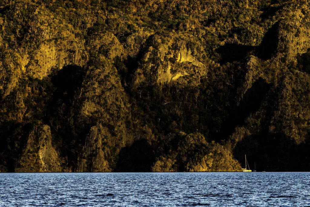Setting sun against the hills in Coron