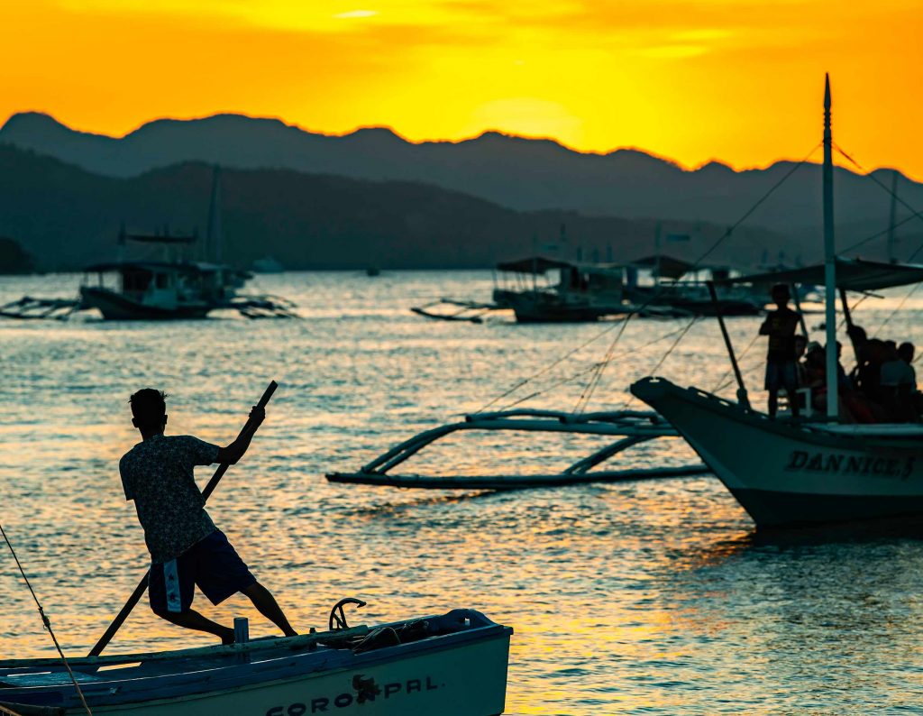 Coron port at sunset - best things to do in Palawan.